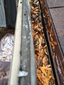 LeafFilter screen failure: The micromesh screen has separated from the vinyl frame, allowing leaves and debris to clog the gutter guard's water channels